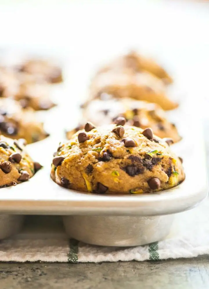 When it comes to zucchini muffin recipes, you can be as creative as you want and this recipe is hitting all the right flavor notes. These muffins feature some of my favorite things like chocolate chips, bananas, and honey for a winning zucchini muffin.